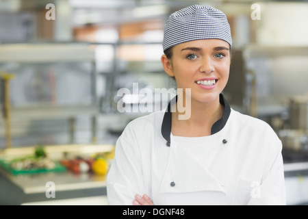 Young female chef smiling at the camera Stock Photo