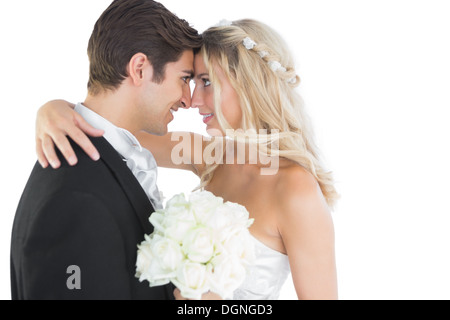Beautiful young married couple looking each other in the face Stock Photo