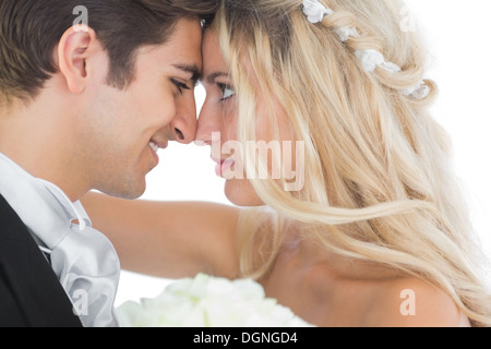 Happy young married couple looking each other in the face Stock Photo