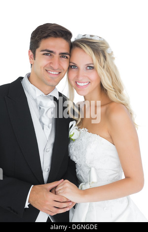 Pretty married couple posing holding hands Stock Photo