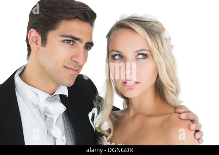 Attractive young wedding couple posing on the blackcurrant field on
