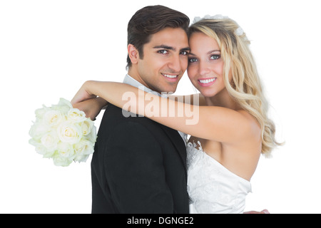 Beautiful bride embracing her husband Stock Photo