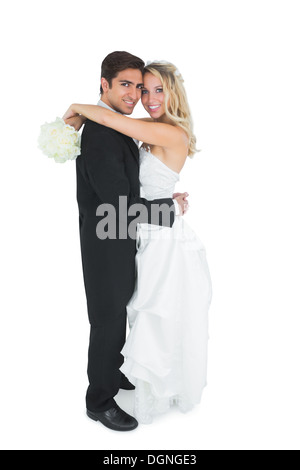 Pretty young bride holding a white bouquet Stock Photo