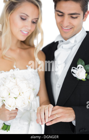 Smiling young married couple wearing wedding rings Stock Photo