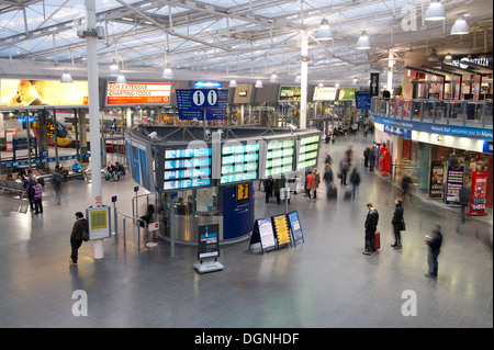 The inside foyer of Manchester Piccadilly railway train station during the evening. Stock Photo