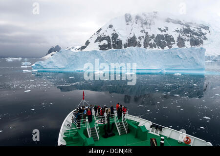 Expedition cruise ship, MS Expedition, in front of an iceberg, Errera Channel, Arctowski Peninsula, Antarctic Peninsula Stock Photo
