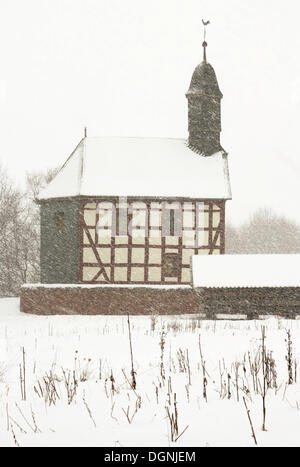 Small village church in the thick snow, winter, winter in Hessenpark, Neu-Anspach, Taunus, Hesse