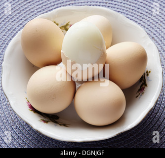Eggs with whisk Stock Photo