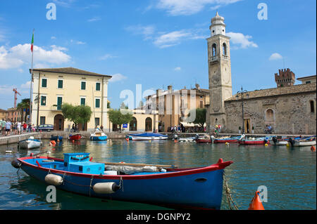 Port of Lazise on Lake Garda, right the church of San Nicolò, Lazise, Italy Stock Photo
