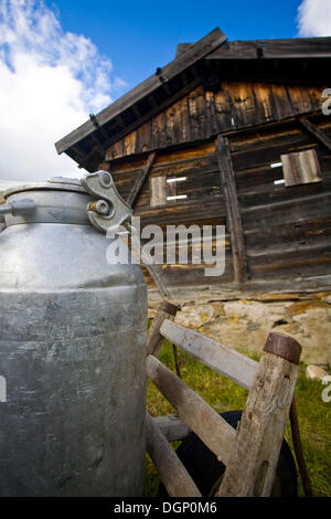 Milk cans on a mountain pasture, South Tyrol, Italy, Europe Stock Photo