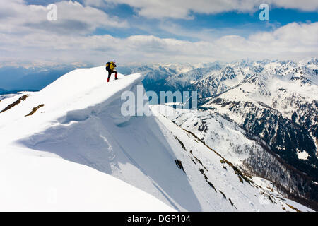 Descent from Laugenspitze Mountain with the Brenta Mountains in the distance, Alto Adige, Italy, Europe Stock Photo