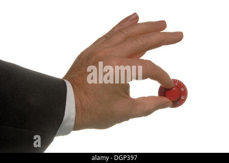Hand turning the combination dial of a safe Stock Photo