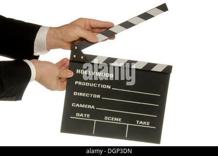 Businessman holding a clapperboard Stock Photo