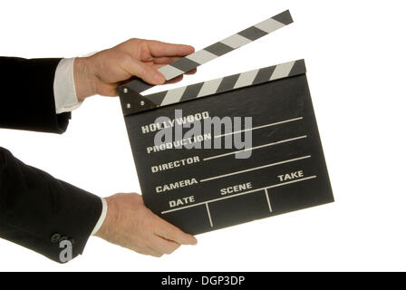 Businessman holding a clapperboard Stock Photo