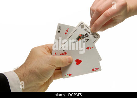 Woman's hand drawing the Black Peter card, symbolic image for bad luck Stock Photo