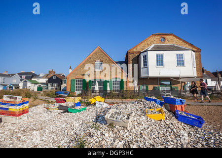 England, Kent, Whitstable, Piles of Oyster Shells and Waterfront Buildings Stock Photo