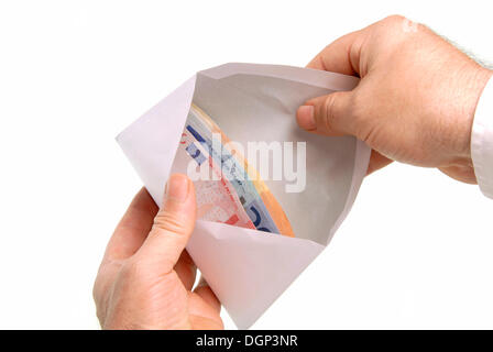 Business man with a pay envelope, money in an envelope Stock Photo