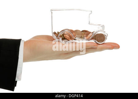 Business man holding a transparent model truck full of euro coints, symbolic image for transparency in transport costs Stock Photo