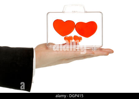 Man holding a transparent case full of hearts Stock Photo