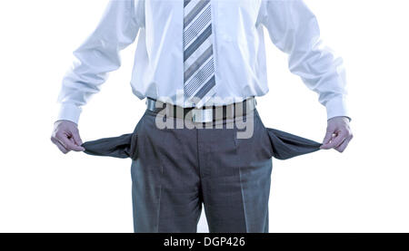 Businessman turning trouser pockets inside out, symbolic image for bankruptcy