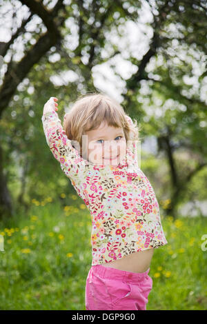 Little girl dancing with a love of life Stock Photo