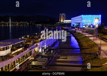 A cruise ship and the Lentos Art Museum on the Danube river, as seen from Nibelungenbruecke bridge, Linz, Upper Austria, Austria Stock Photo