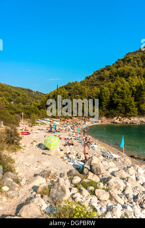 Tourists relaxing on Pupnatska beach near Pupnat, Croatia Stock Photo