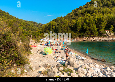 Tourists relaxing on Pupnatska beach near Pupnat, Croatia Stock Photo