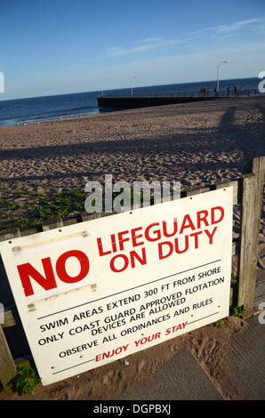 No Lifeguard on Duty sign in beach of West Haven, Connecticut Stock Photo