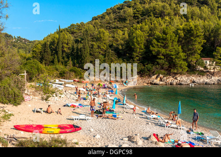 Tourists relaxing on Pupnatska beach near Pupnat, Croatia Stock Photo