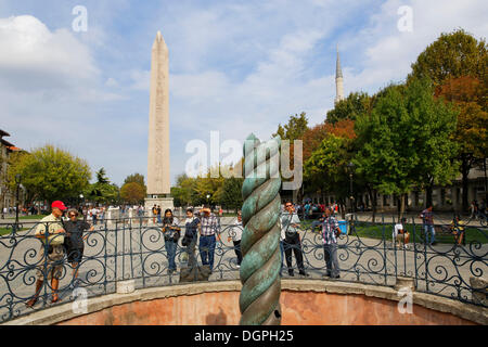 Serpentine Column, in the rear the Obelisk of Thutmosis III, Hippodrome or At Meydani square, Istanbul, European side Stock Photo