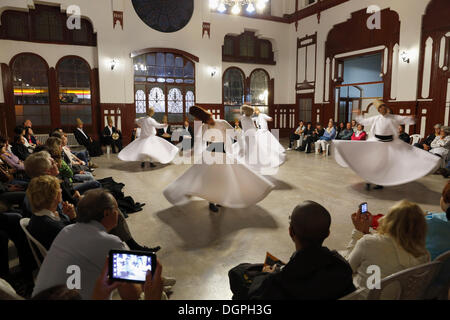 Whirling Dervishes dancing the Sema, a Dervish dance, Sirkeci Railway Station, Istanbul, Turkey, Europe, Istanbul Stock Photo