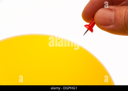 Straight Pin and a Yellow Balloon Stock Photo