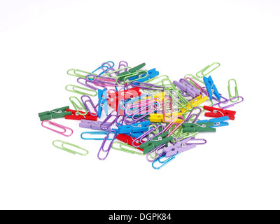 Paper clips and pegs on a white background. Stock Photo