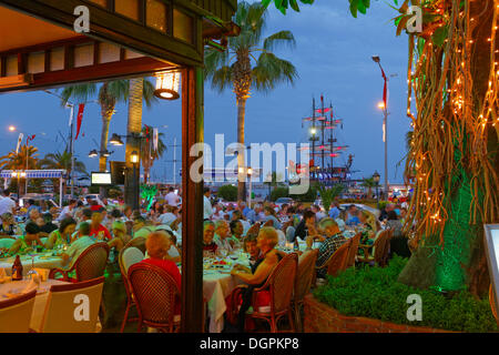 Restaurant at the harbour at night, Alanya, Turkish Riviera, Province of Antalya, Mediterranean Region, Turkey Stock Photo