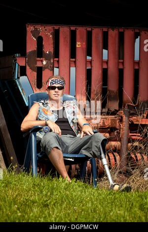 Biker with a prosthetic leg Stock Photo