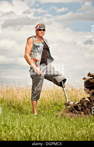 Biker with a prosthetic leg Stock Photo
