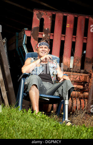 Biker with a prosthetic leg Stock Photo
