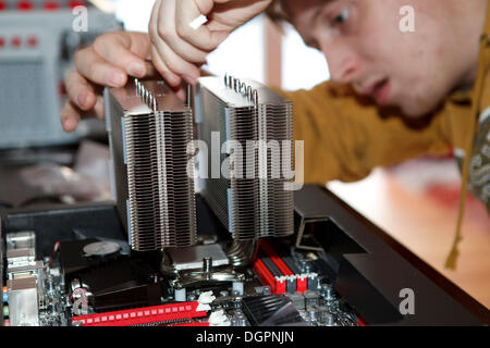 Young man assembling a computer Stock Photo