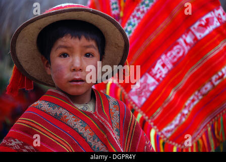 Little Indian boy wearing colourful festive costume, near Cusco or Cuzco, Peru, South America Stock Photo