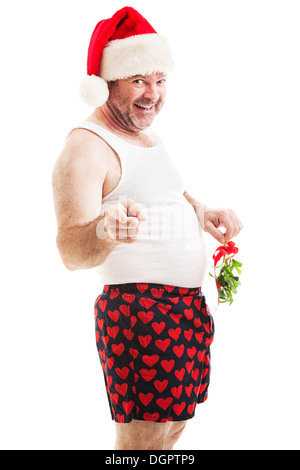 Horny middle aged man in a santa hat and his underwear holding