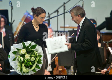 Nuremberg, Germany. 24th Oct, 2013. Record national soccer player and double world champion Birgit Prinz is appointed honorary team captain and receives a certificate from DFB president Wolfgang Niersbach during the DFB Bundestag, the highest council of German Football Association, meeting every three years, at the Convention Center in Nuremberg, Germany, 24 October 2013. Photo: Daniel Karmann/dpa/Alamy Live News Stock Photo