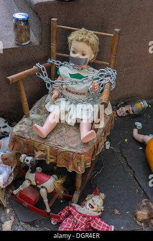 Brooklyne, NY, USA. 23rd Oct, 2013. A gruesome Halloween display is seen in the neighborhood of Boerum Hill in Brooklyn in New York on Wednesday, October 23, 2013. The holiday extravaganza in a the front yard features mutilated dolls with blood galore and is eliciting both pro and con reactions from residents and passer by.   (© Richard B. Levine) Credit:  Richard Levine/Alamy Live News Stock Photo