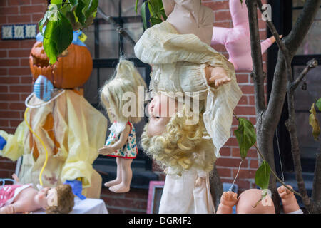 Brooklyne, NY, USA. 23rd Oct, 2013. A gruesome Halloween display is seen in the neighborhood of Boerum Hill in Brooklyn in New York on Wednesday, October 23, 2013. The holiday extravaganza a the front yard features mutilated dolls with blood galore and is elicting both pro and con reactions from residents and passer by.   (© Richard B. Levine) Credit:  Richard Levine/Alamy Live News Stock Photo