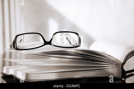 Artwork in retro style, glasses and book Stock Photo