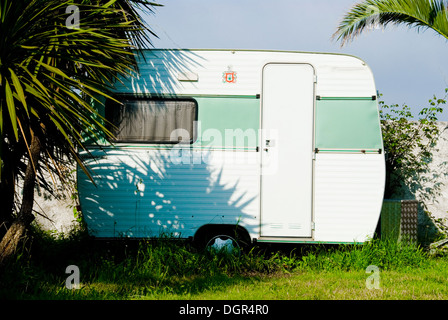 A small caravan at a campsite Stock Photo