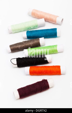 Set of sewing threads and accessories on light background Stock Photo ...