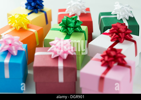 Various colour gift boxes wrapped with ribbons and bow Stock Photo
