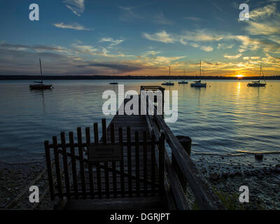 Jetty on Lake Ammer at dusk, Bavaria Stock Photo