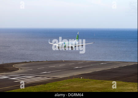 Landing approach of passenger plane of Transavia Airlines at the airport of Madeira, LPMA, Funchal Airport or Airport Santa Stock Photo